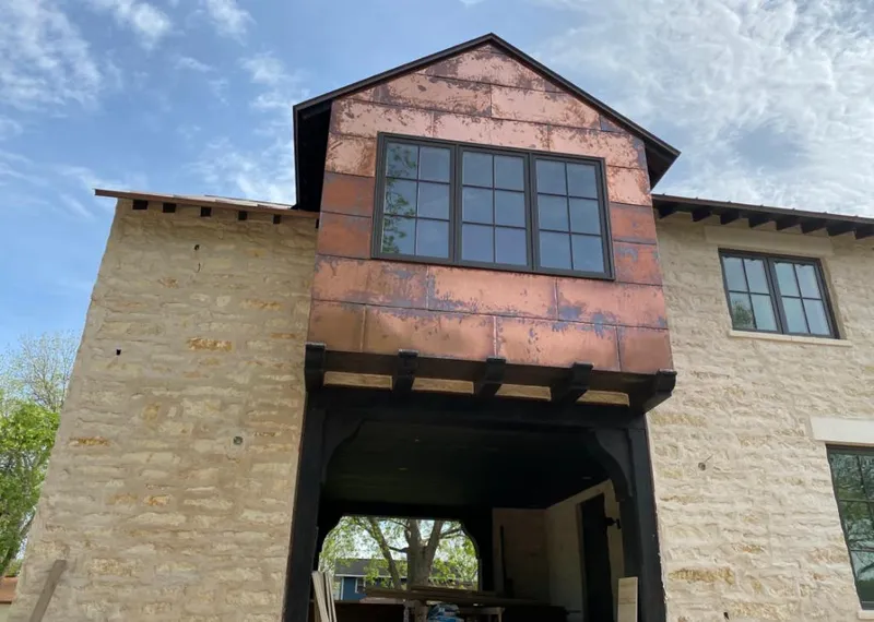 Copper metal panel facade on a stone building for Skylight Installation in Myrtletown