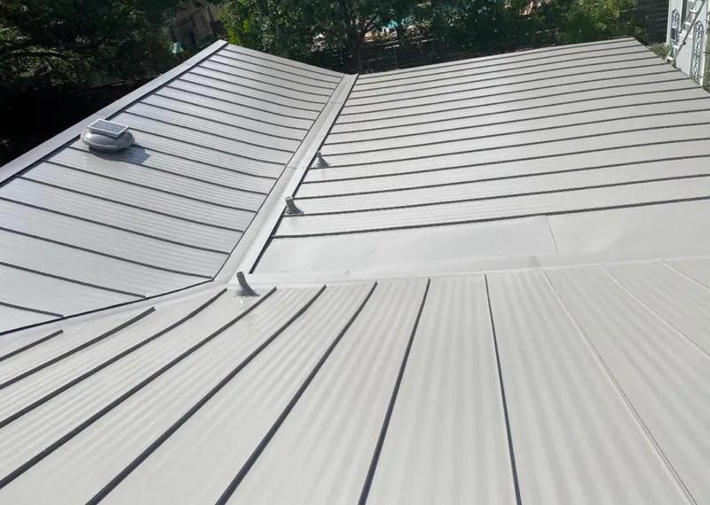 Solar attic fan installed on a metal roof for Roof Ventilation in Myrtletown